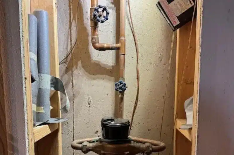 Plumber installing new PEX supply lines in an opened wall-whole-home repipe